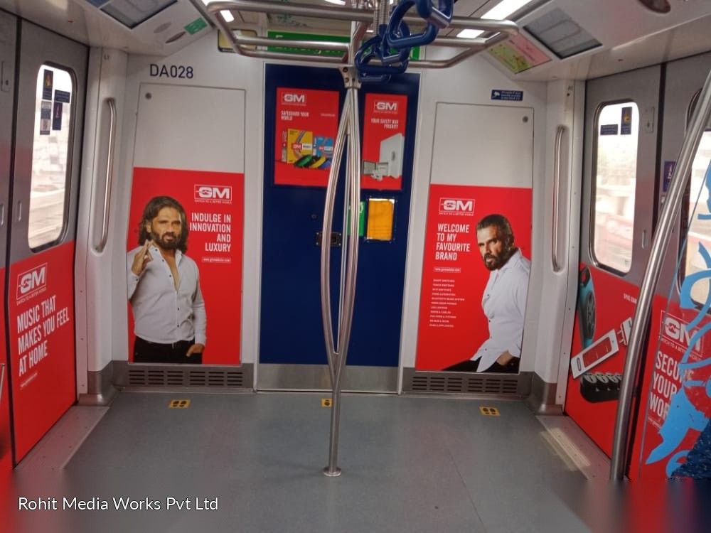 Interior branding panels beside metro coach doors